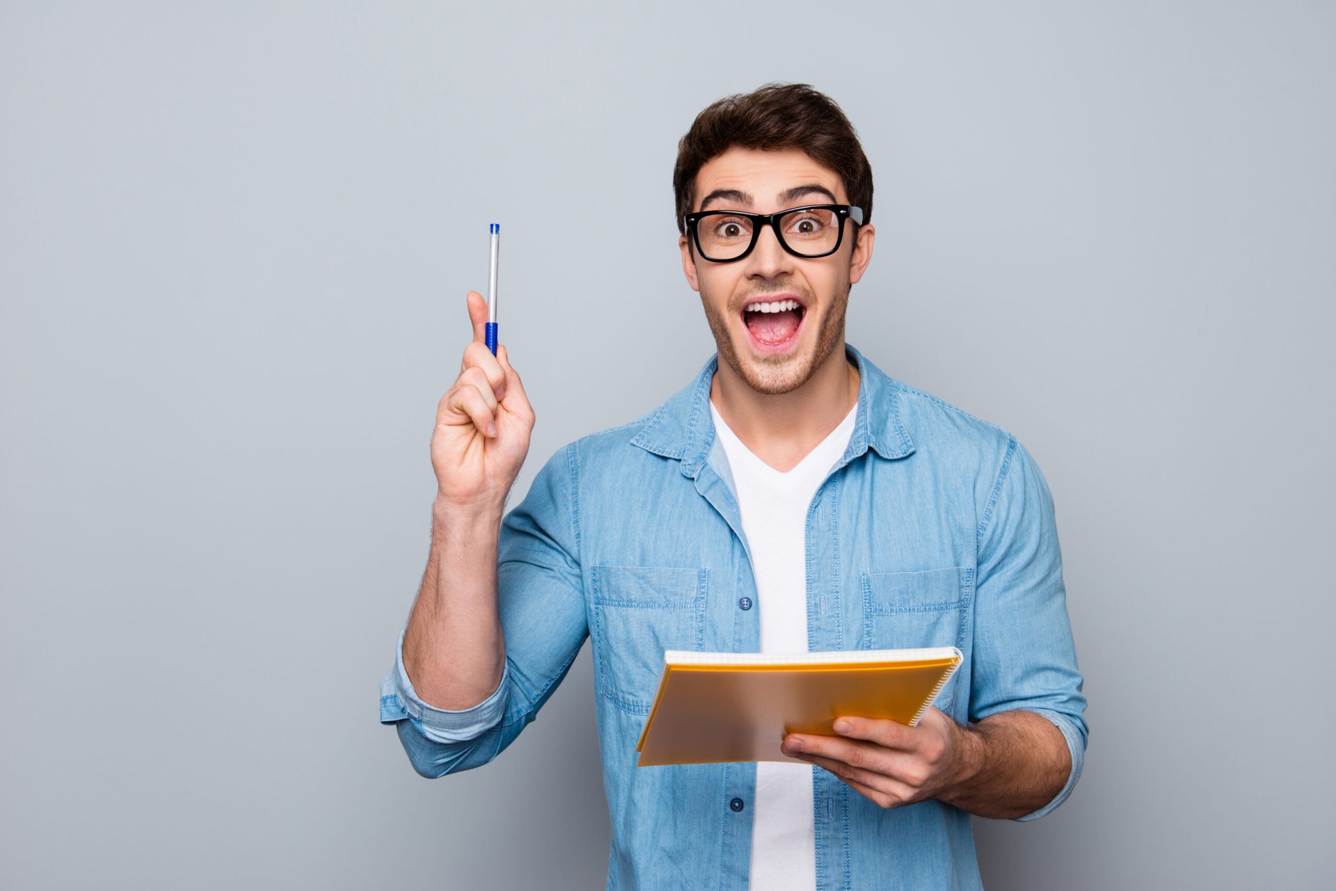 man with pen and notebook