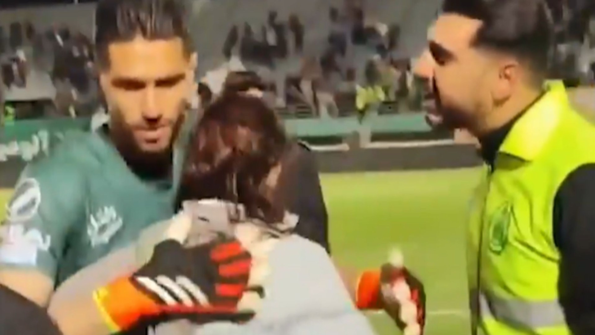 Iranian footballer bundled away by security & BANNED after ‘hugging female fan who wasn’t wearing a hijab’