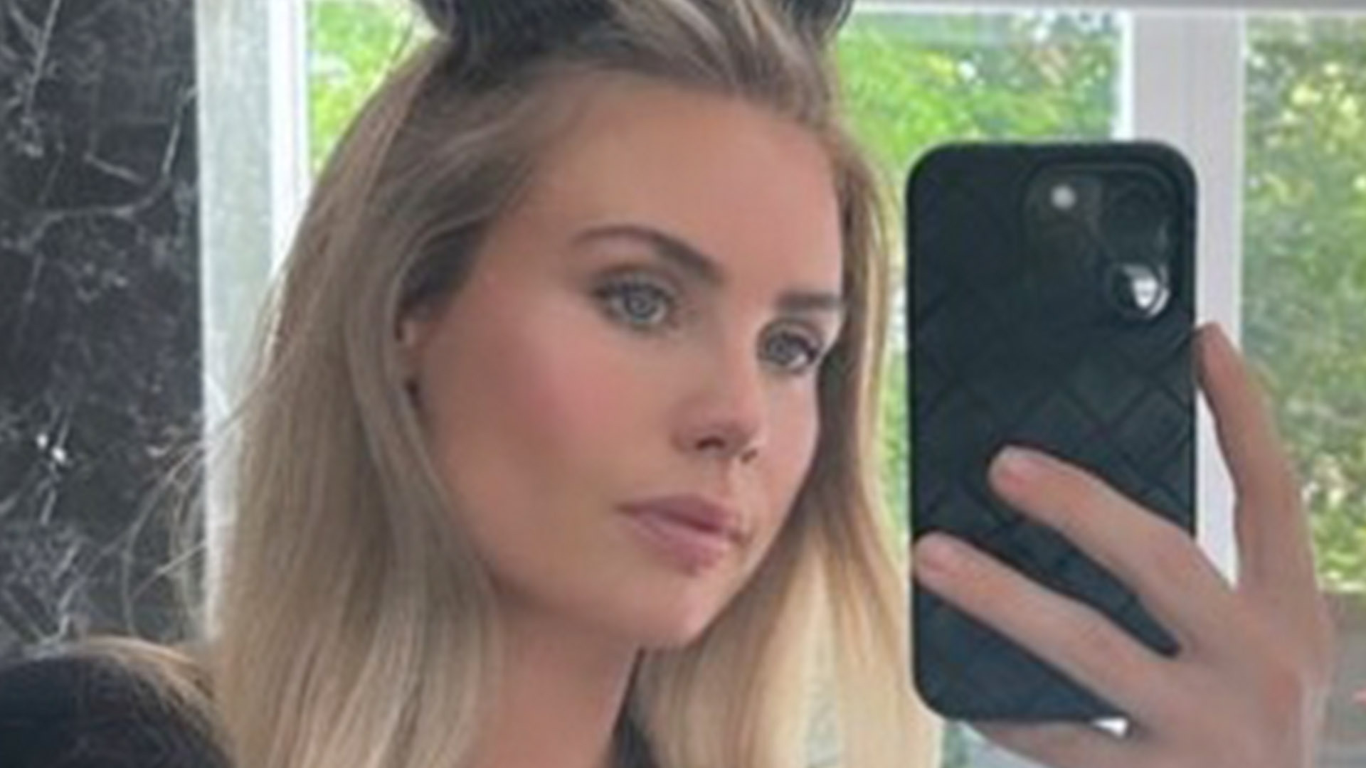 Premier League’s hottest Wag goes braless and nearly spills out of gown in stunning snap as she gets dressed