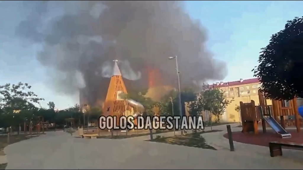 This photo taken from video released by Golos Dagestana shows smoke rises following an attack in Makhachkala, republic of Dagestan, Russia, Sunday, June 23, 2024. Russian state news agency RIA Novosti says that armed militants attacked two Orthodox churches, a synagogue and a traffic police post in Russia