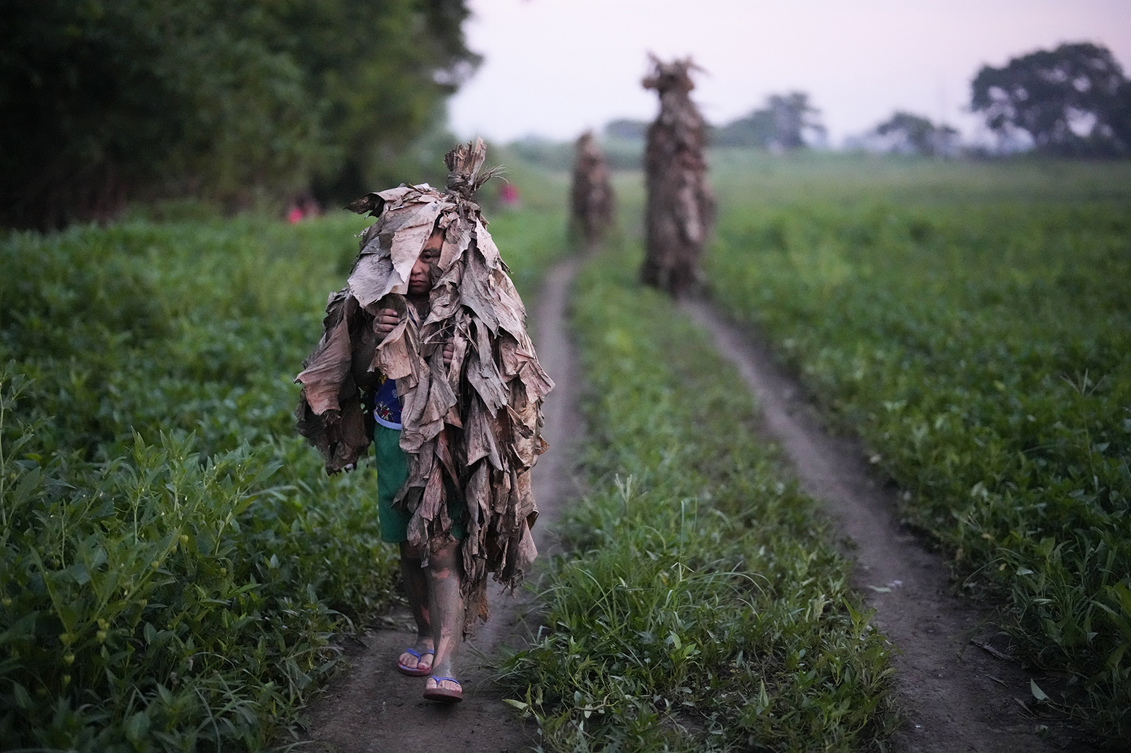 Photos of the Week: Mud People; Eucharistic Pilgrimage