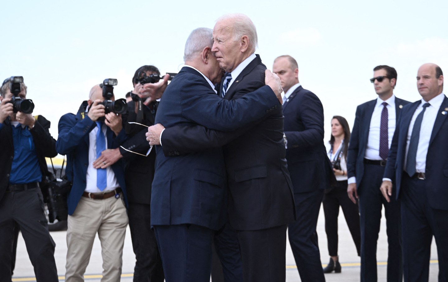 Israel Prime Minister Benjamin Netanyahu hugs US President Joe Biden upon his arrival at Tel Aviv