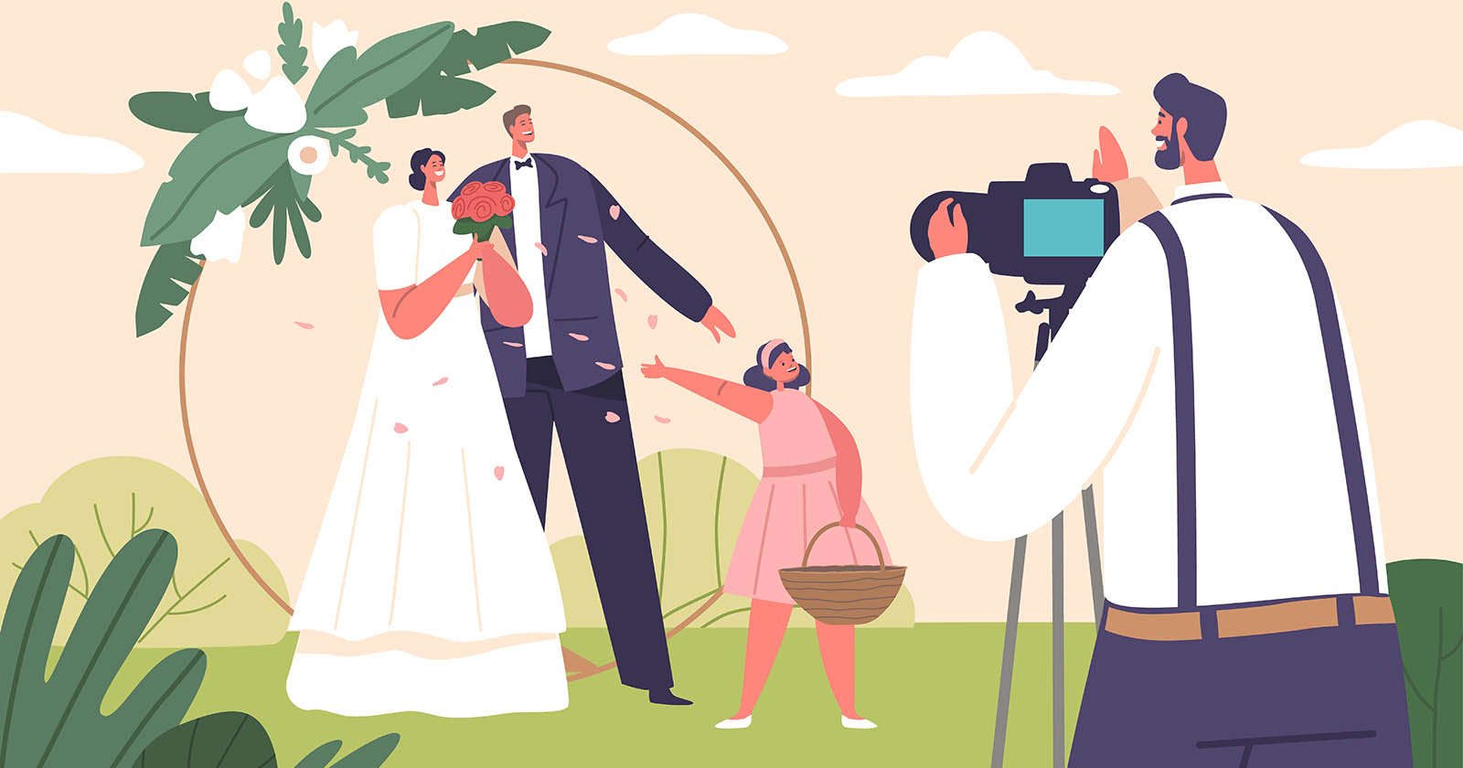 A couple dressed in wedding attire poses for a photograph with a young flower girl. The photographer captures the moment as the flower girl, holding a basket, points excitedly. The background features greenery and a decorative floral arch.