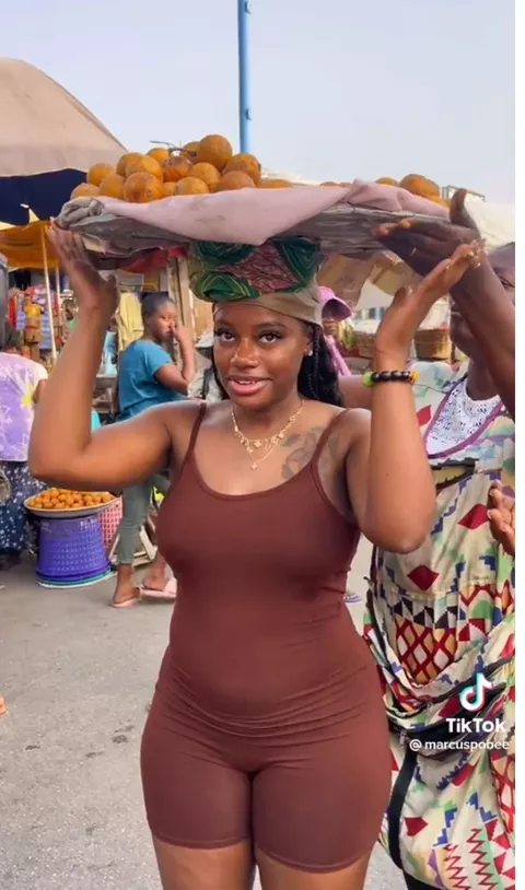 “I’ll Buy The Whole Tray” – Reactions As Curvy Lady Dresses In Tight Playsuit To Sell Fruits – TheNGblog