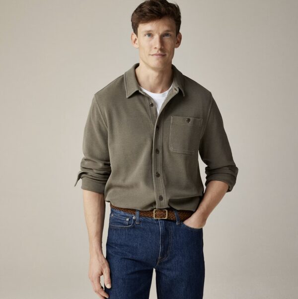 man wearing a long sleeve button front waffle shirt with denim jeans