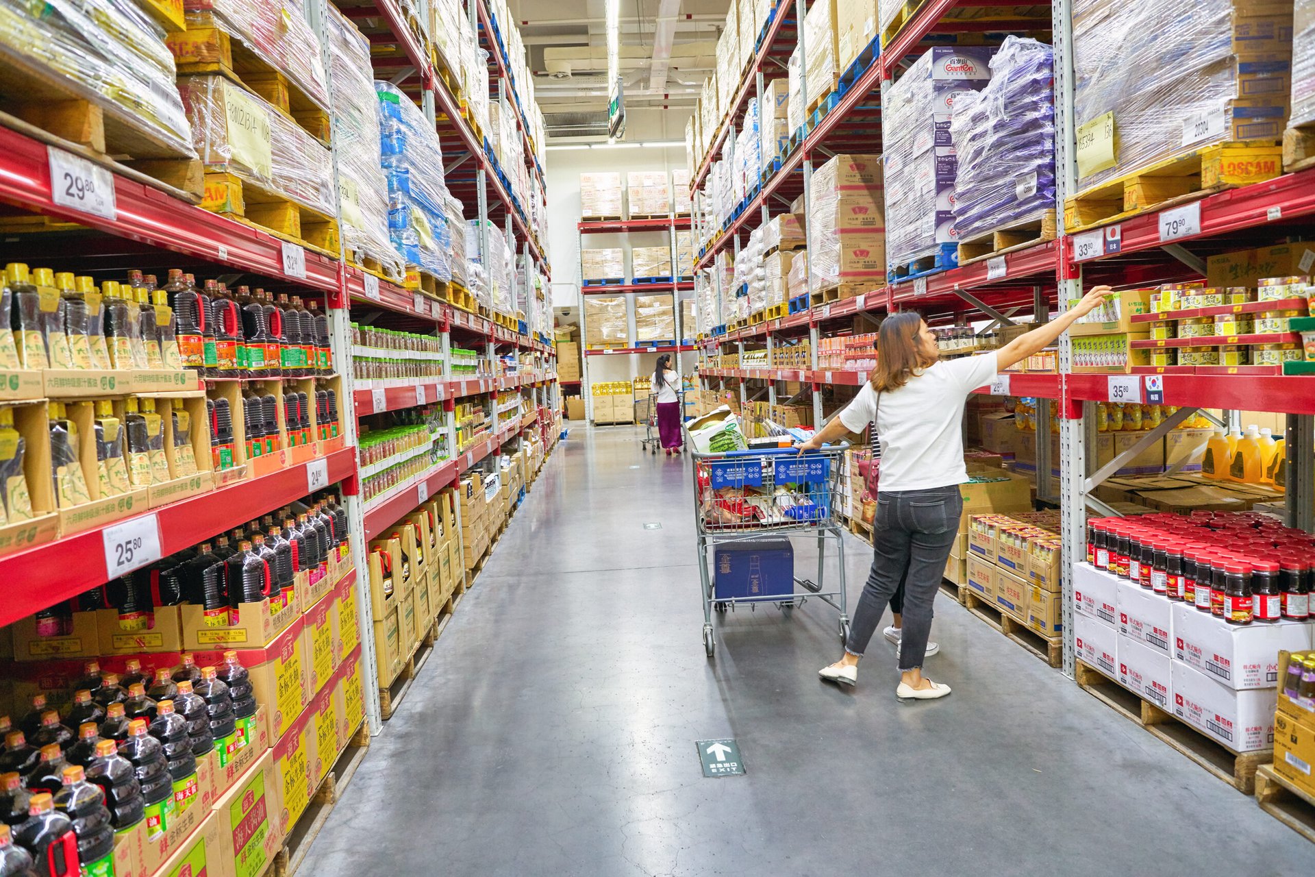 A woman shopping for bulk products at Sam's Club.