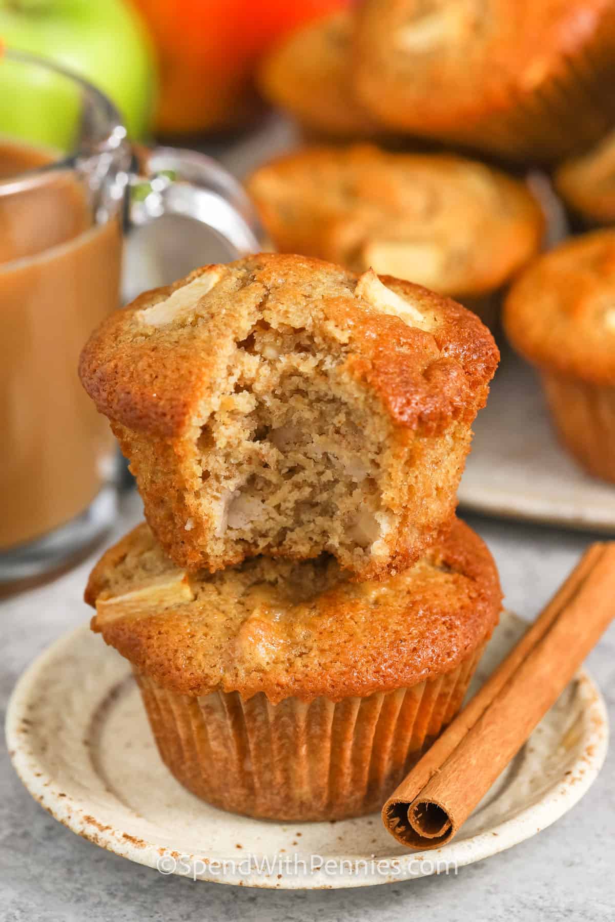 stack of Apple Muffins with a bite taken out of one