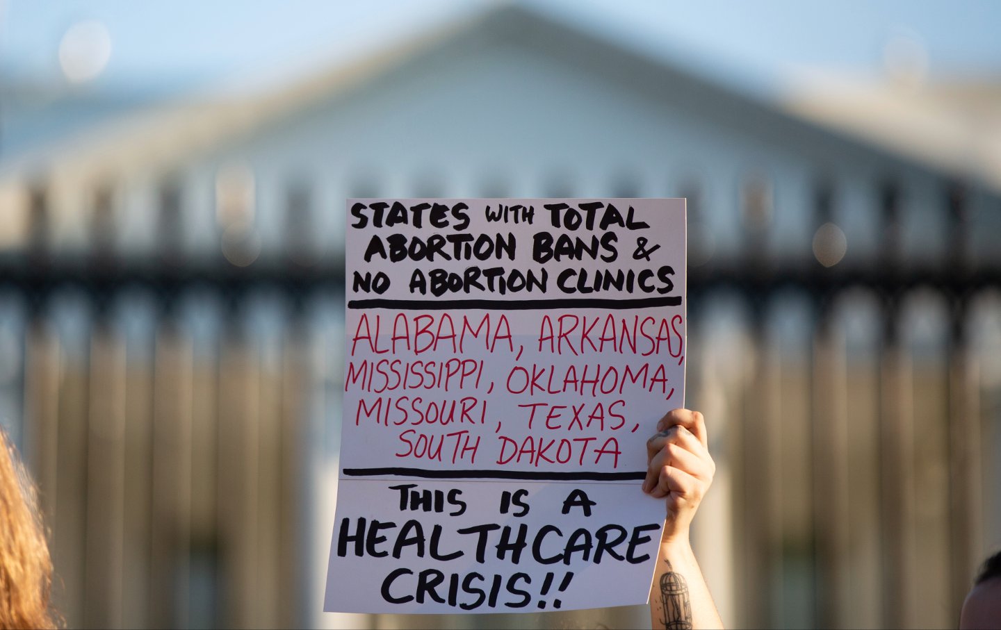 A sign from a reproductive justice rally outside the White House on August 23, 2022.