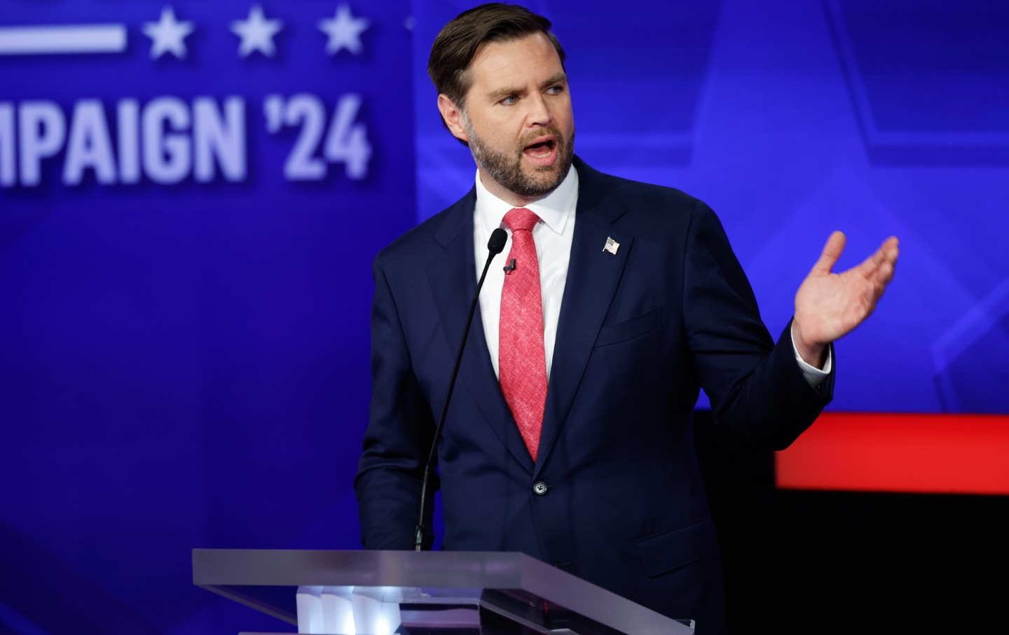 Sen. JD Vance gestures to his left at his podium at the vice presidential debate.